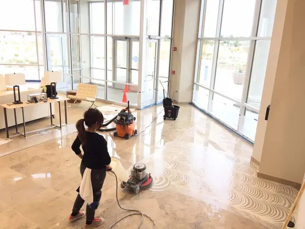 Technician polishing a natural stone floor